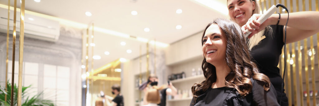 Hair stylist doing hairdo