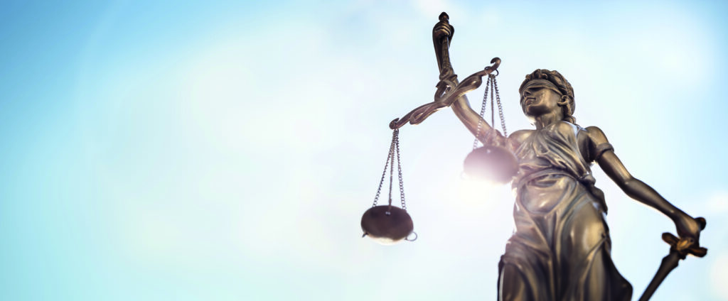 Legal law concept statue of Lady Justice with scales of justice