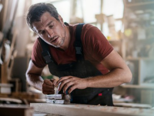 Carpenter at work stock photo