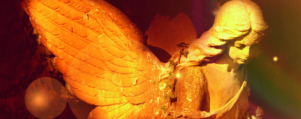 golden angel in the sunlight (antique statue)