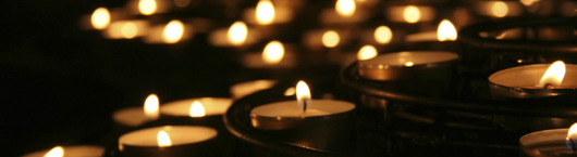 Charity. Praying candles in a temple.