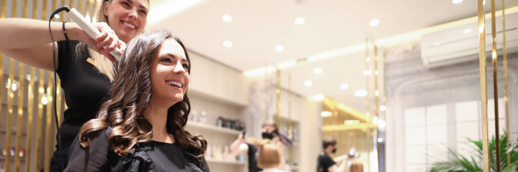 Hair stylist doing hairdo