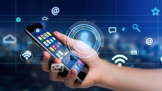 Businessman using a smartphone with a Contact icon surrounding by app and social icon – 3d render