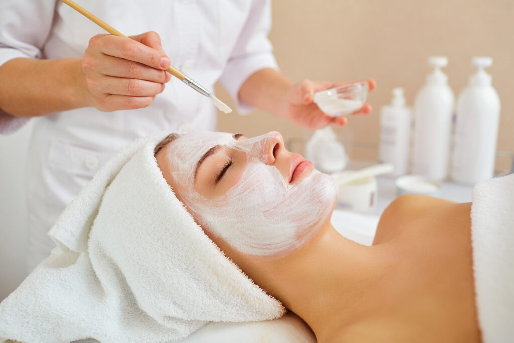 Woman in mask on face in spa beauty salon