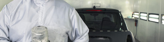 Worker ready to paint a car  close up.